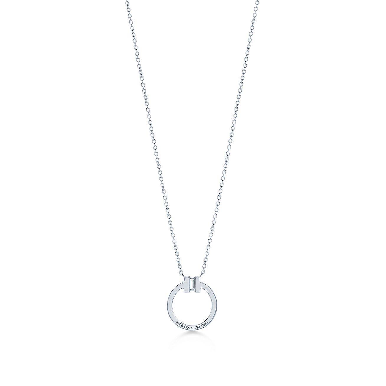 T*f*ny t diamond pendant in 18k white gold with a baguette diamond